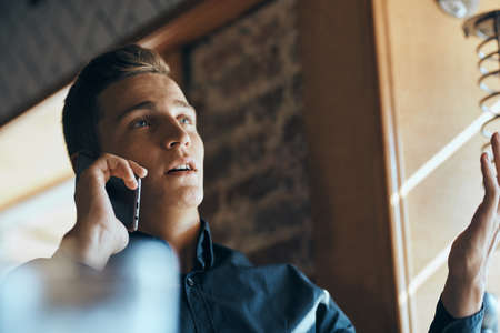 Business man freelancer working in a cafe laptops communication phone room manager model