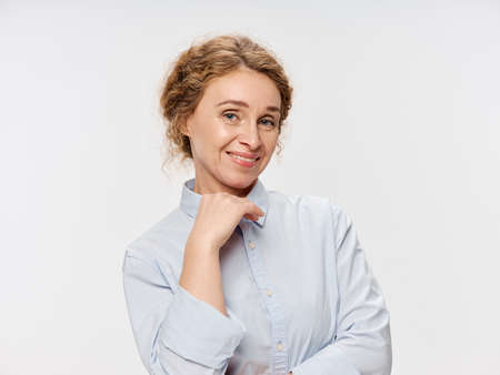 Elderly woman blue shirt smile businesswoman office