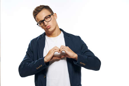 Business man in a jacket with glasses emotions official manager light background studio
