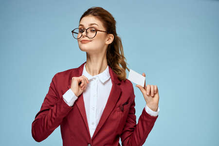 Business woman red jacket business card official glasses blue background