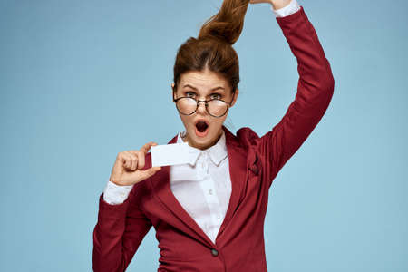 Business woman red jacket business card official glasses blue background