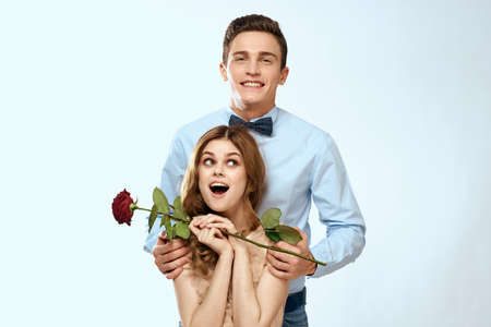 married couple man and woman romance red rose isolated background holiday flowers