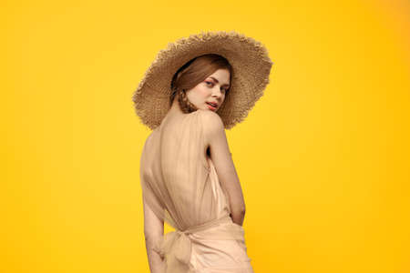 portrait of woman with red pigtails on yellow background cropped view emotion fun