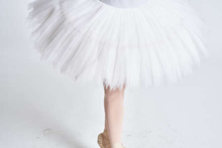 ballerina white tutu dance exercise performance light backgroundの写真素材