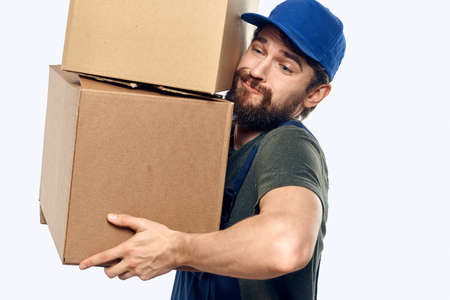 Working man with boxes in hands delivery service work lifestyleの写真素材