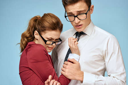 Business young couple officials office team office blue backgroundの写真素材