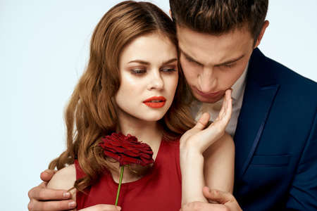 Young couple charm dating romance relationship embrace light backgroundの写真素材