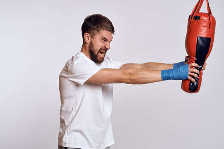Sports car punching bag bandages on the hands of the exerciseの写真素材
