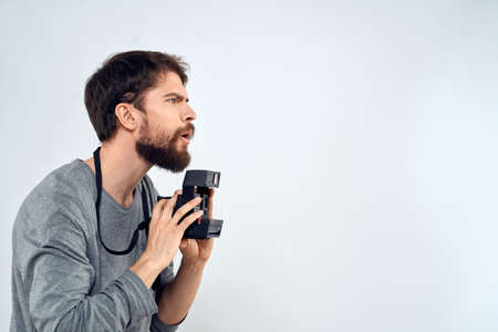 photographer with camera hobby technology studio lifestyle creative light backgroundの写真素材