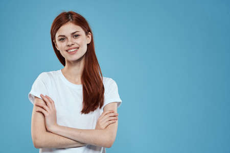 pretty woman white tshirt long hair glamor lifestyle cropped view blue background