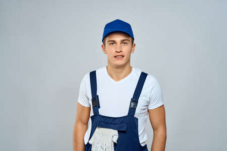 working man in uniform service lifestyle delivery service light backgroundの写真素材