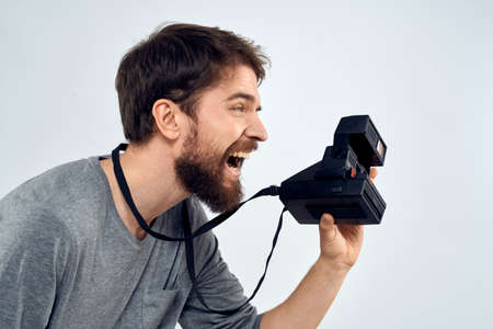 photographer with camera hobby technology studio lifestyle creative light backgroundの写真素材