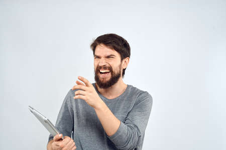 Man with laptop in hands technology internet self-confidence light background