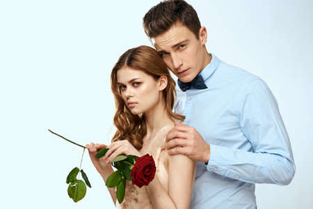 man giving woman roses relationship charm lifestyle embrace lifestyle