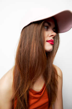 Woman with a cap charm model side view on her head red dress