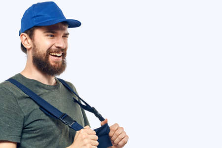 Worker man uniform delivery service emotions studio light backgroundの写真素材