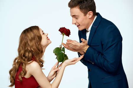 Young couple charm dating romance relationship embrace light backgroundの写真素材