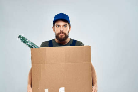 Worker man with box delivery packing work serviceの写真素材