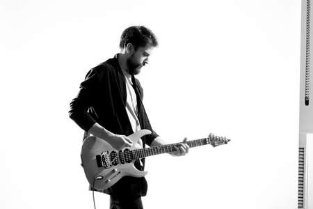 Male musician with guitar rock star performing entertainment programの写真素材