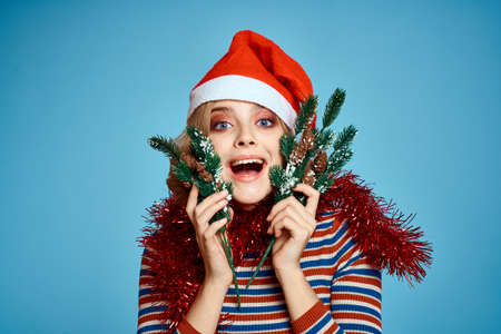 energetic woman with christmas tree hands tree branches model red hat new year
