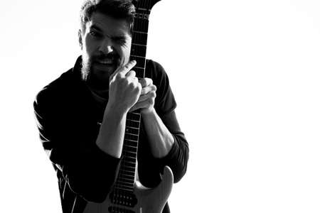 Male musician with guitar rock star performing entertainment programの写真素材