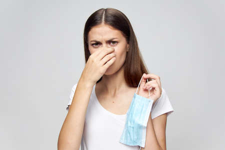 woman Medical mask in hand health problems protectionの写真素材