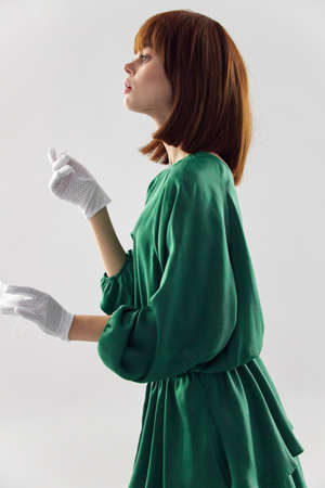 Woman in fashion dress posing in medical mask virusの写真素材