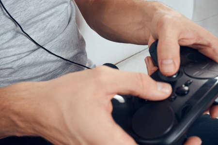 Gamepad male hands close-up video game addiction office technology