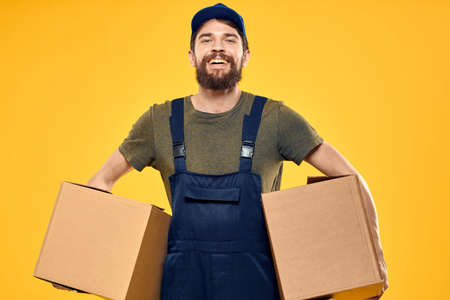working man with box in hands delivery loading transportation serviceの写真素材