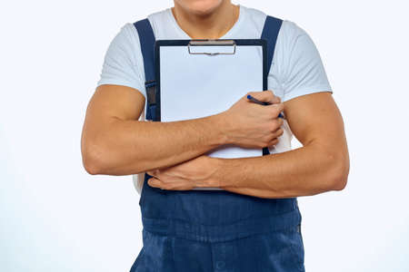 Working man in uniform documents delivery service courier