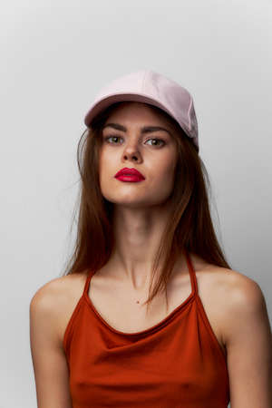 Woman with a cap Look forward cropped view of the model on her head red lipsの写真素材
