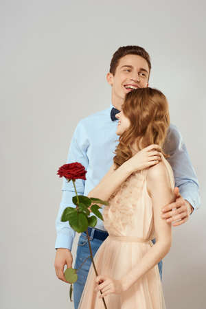 man giving woman roses relationship charm lifestyle embrace lifestyleの写真素材