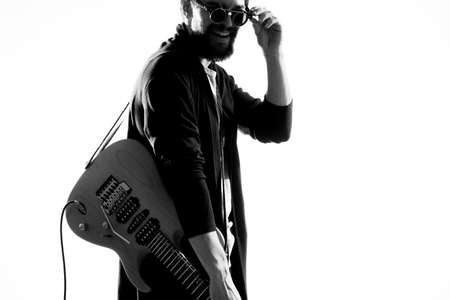 Male musician with guitar rock star performing entertainment programの写真素材