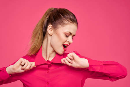 attractive girl in pink shirt cropped view bright makeup red lips gesturing with hands Copy Spaceの写真素材