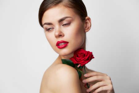 Beautiful woman with rose Clear skin side viewの写真素材