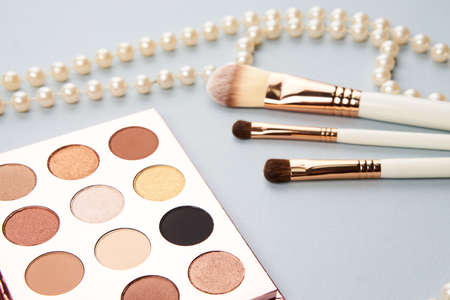eyeshadow accessories beads makeup brushes collection professional cosmetics on gray backgroundの写真素材