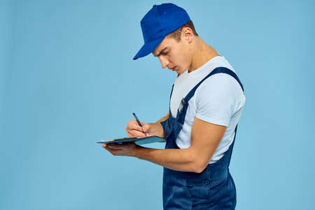 Delivery service man worker rendering service blue backgroundの写真素材