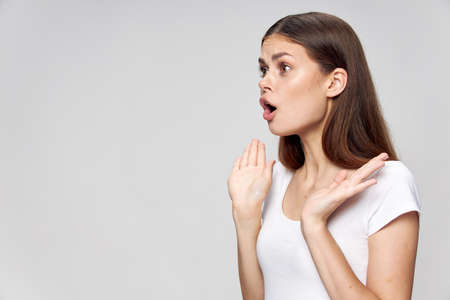 emotional woman open mouth from surprise look asideの写真素材