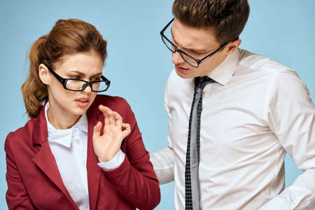 Business young couple officials office team office blue backgroundの写真素材