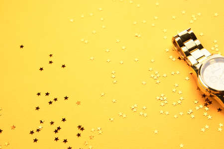 Accessories watch gold yellow background sequins decorationの写真素材