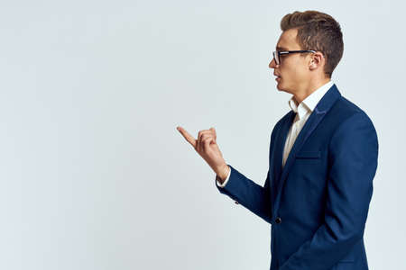 Business man in a suit of self-confidence official and recognizes a light background