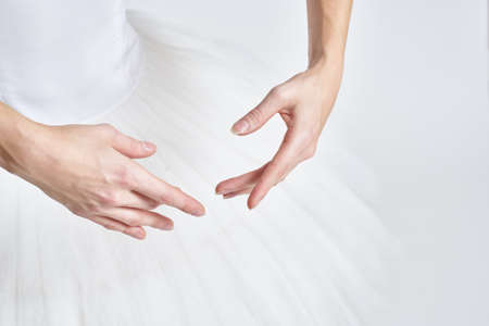 Ballerina in white tutu elegant dance performed sensuality silhouette light backgroundの写真素材