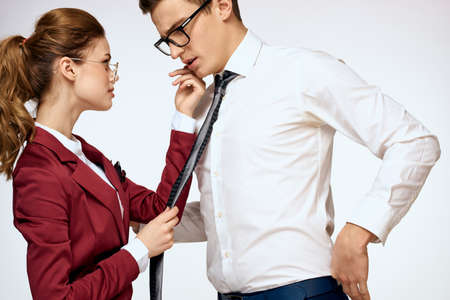 man and woman work colleagues officials communication light backgroundの写真素材
