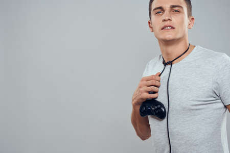 Man with joystick wires technology games entertainment hobby light background
