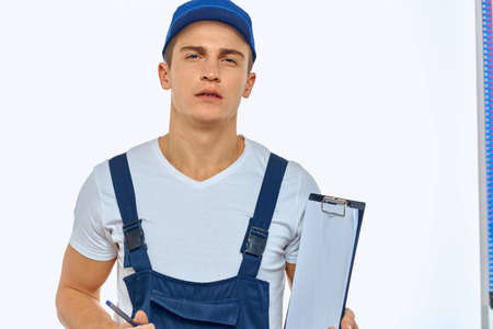 Working man in uniform documents delivery service courierの写真素材