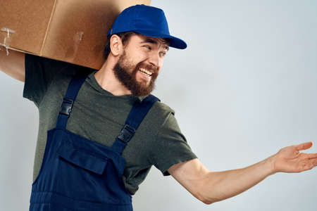 Male worker loading delivery boxes in hands packing lifestyleの写真素材