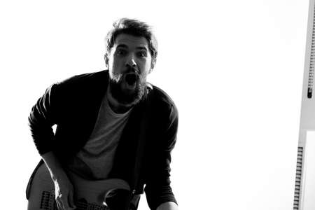 Musician with guitar rock star emotions entertainment modern performerの写真素材