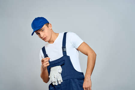 working man in uniform service lifestyle delivery service light backgroundの写真素材