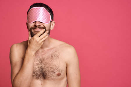 man with head massager relax body care pink backgroundの写真素材