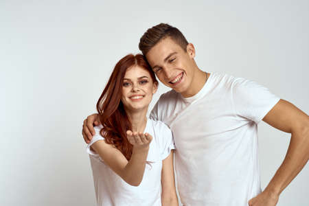 Portrait of man and woman on light backgroundの写真素材